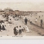 Postcard with a sepia coloured photograph of families on the beach and in the water at St Kilda beach 