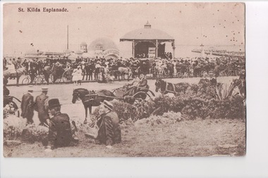Postcard of sepia image of well dressed people lining roadway with horse and buggies in foreground
