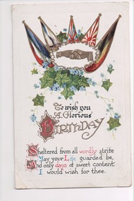 Colour postcard of a hand shake surrounded by five flags of the allies, ivy and flowers above a birthday greeting. 