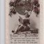 Colour postcard with image of a young girl reading a book beneath a round window adorned by pink roses and above a birthday greeting.