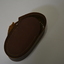Brown leather pouch containing a wooden brush.  Flap is locked by a metal buckle.  Has large yellowing stitching.