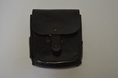 Dark brown leather pouch with a metal star on front flap, surrounded by brown stitching.  Has a button clasp with same stitching at the side.  On left side are two small pockets and on the right one small pocket.