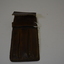 Home made tan leather pen case for three pens.  Has large yellowing stitching.