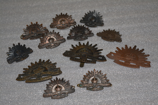Large and small rising sun badges