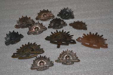 Large and small rising sun badges