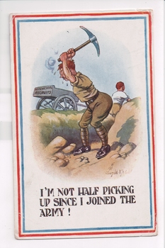 Soldier in trench with pick above head with cart in background