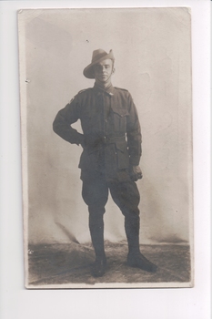 Soldier wearing slouch hat standing with right hand on hip
