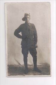 Soldier wearing slouch hat standing with right hand on hip