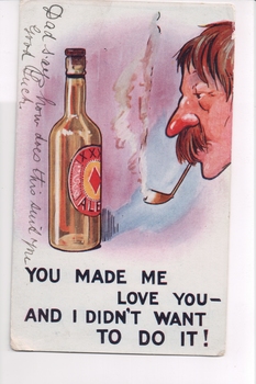 Man with big moustache smoking a pipe looking at large bottle of beer
