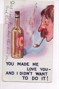 Man with big moustache smoking a pipe looking at large bottle of beer