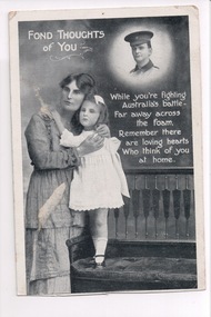 Woman holding child standing on chair with face of soldier top right of black and white postcard