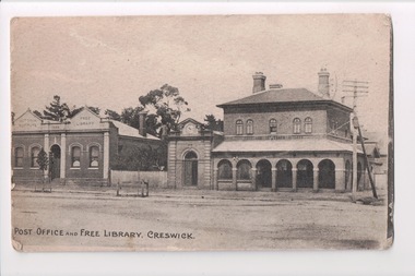 Postcard of town  buildings and street