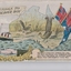 Colour postcard of ship at sea, two flags and two lyrebirds within shape of Australia