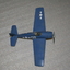 Small blue model aircraft with one star on wing 