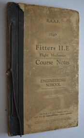 Book has black binding with black cord to bind it. Cover is a dirty cream colour with black writing. 