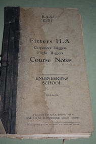 Manuel has black binding with black cord.  Hard cover  is a dirty cream colour with black writing.  Water stain on front cover.