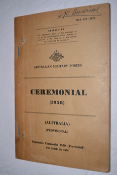 Light Brown paperback  book with black writing with Australia crest.