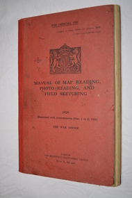 Red bound book with black writing and British crest