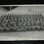 Black and white unframed photograph of large troop of Light Horse soldiers taken at side of a grandstand.