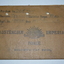 Brown canvas booklet with rising sun emblem and writing in black ink.