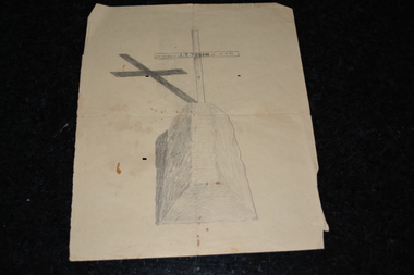 Hand drawn sketch in pencil of grave with cross on cream coloured paper