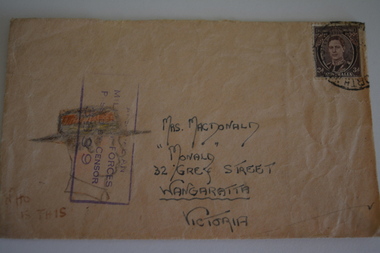 Cream paper envelope with drawing of side profile of male wearing hat.
