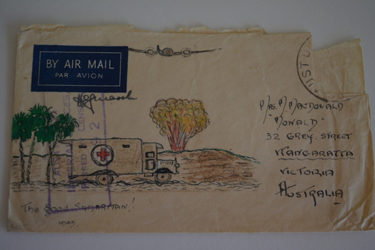 Cream paper envelope with coloured sketch of three palm trees an ambulance and plane overhead with bomb exploding in distance.