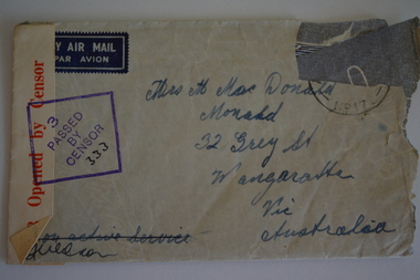 Cream paper envelope with handwritten address, censor stamp and sticker. 