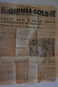 Two page cream coloured newspaper with black print and photograph.