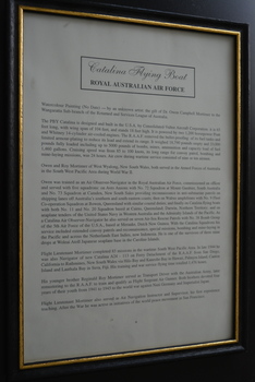 Black frame with gold painted inner edge containing cream coloured paper with black text.