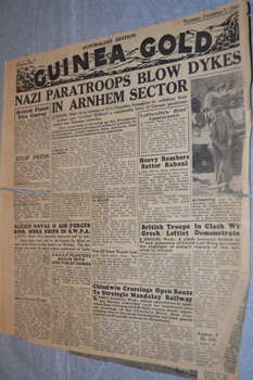 Two page cream coloured newspaper with black print and photograph.