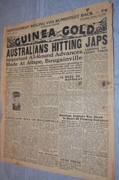 Two page cream coloured newspaper with black print and photograph.