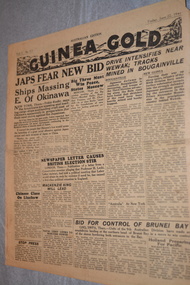 Two page cream coloured newspaper with black print.