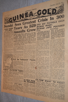 Two page cream coloured newspaper with black print.