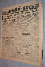 Two page cream coloured newspaper with black print.