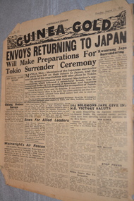 Two page cream coloured newspaper with black print.