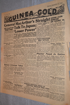 Two page cream coloured newspaper with black print and photograph.