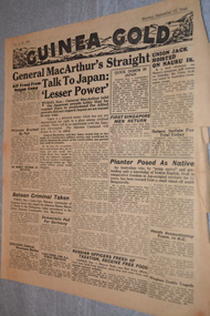 Two page cream coloured newspaper with black print and photograph.