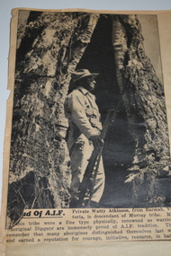 Four black and white newspaper articles with photographs adhered to cream paper