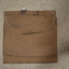 Brown canvas double sided pouch bag that has a brown cloth overlay. Attached on top is small metal ring near  tear repaired by hand stitching.