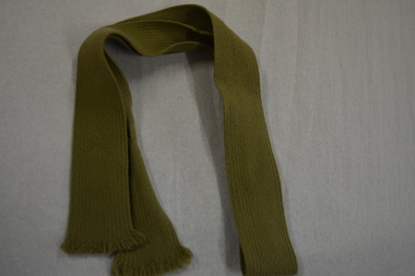 Neck tie made from khaki coloured woven material
