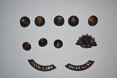 brass military buttons and badges