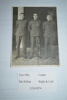 Original black and white photograph of 3 soldiers standing In a row