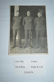 Original black and white photograph of 3 soldiers standing In a row