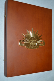 Timber look laminate box  with gold colour metal "rising sun" badge on front.  The box opens out flat and contains seven metal " rising sun " badges mounted on black felt on the right side.