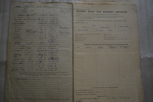 Green bound folder contains handwritten records of service and numerous training and annual inspection certificates.