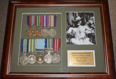Two star and eight round shaped medals all attached to various striped ribbons framed together with photograph and plaque