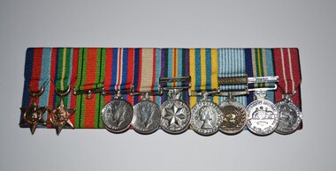Two star and seven round shaped miniature medals all attached to various striped ribbons 
