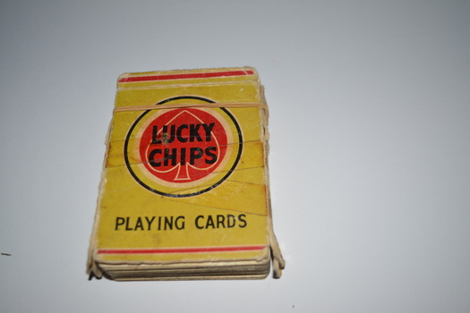 Light green cardboard packet containing playing cards