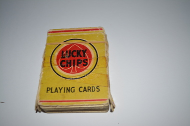 Light green cardboard packet containing playing cards